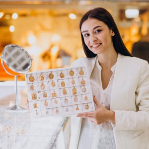 Female sales person at jewelry shop